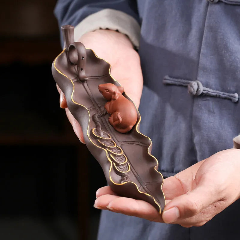 Purple clay ceramic lying incense burner with golden rat design for incense sticks