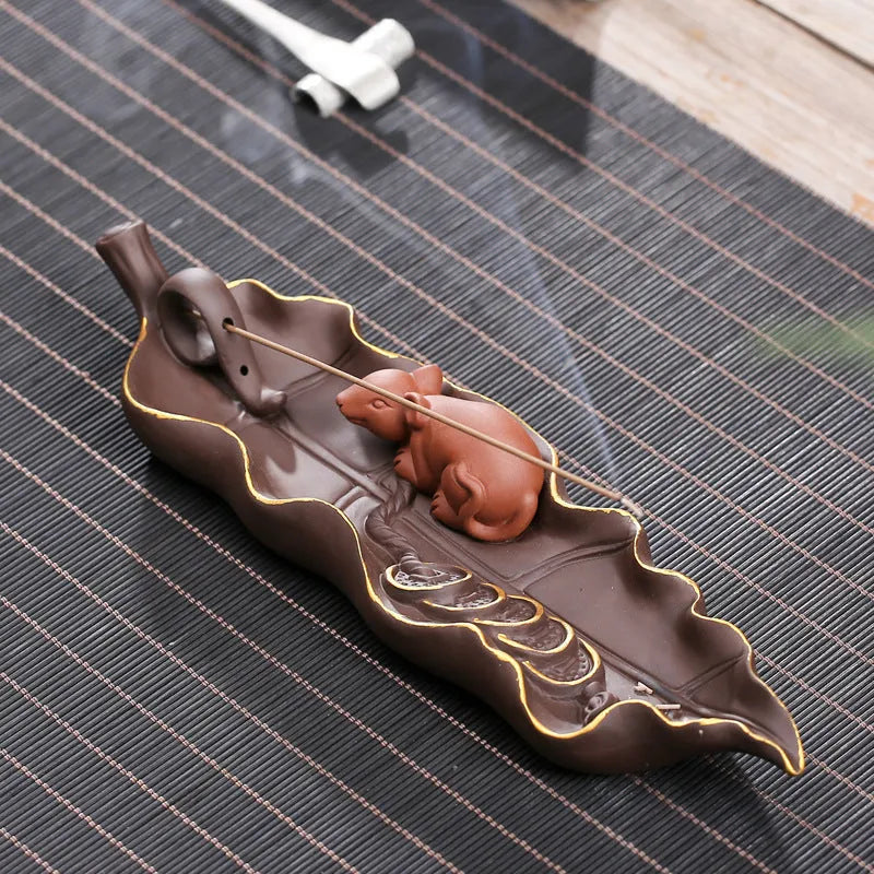 Purple clay ceramic lying incense burner with golden rat design for incense sticks