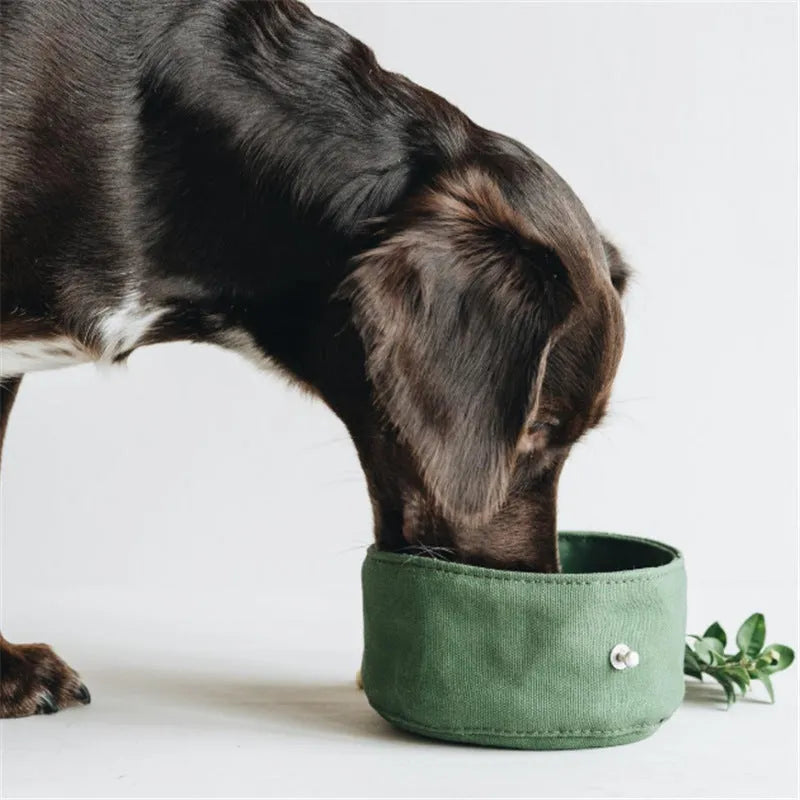 Waterproof foldable travel dog bowl in oil wax canvas, round shape, 150x75mm, shown in green or grey