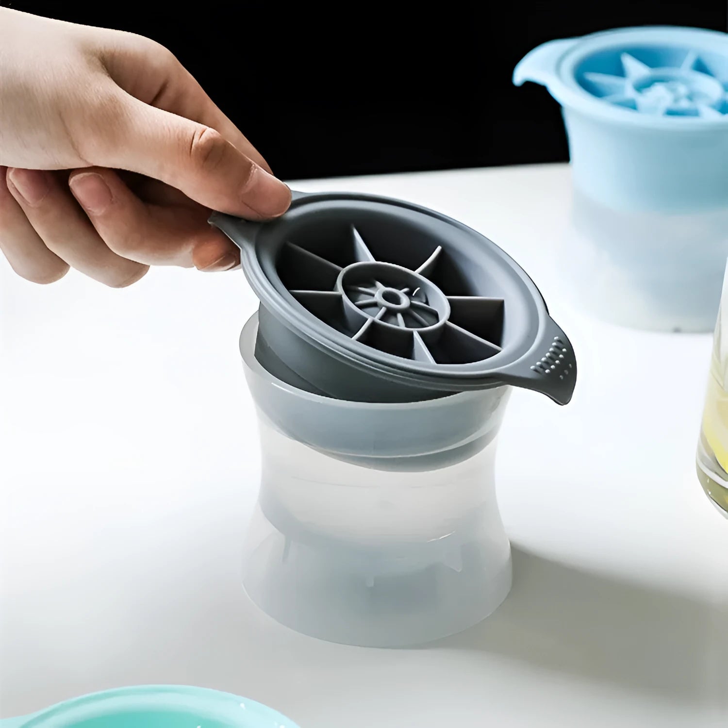 Silicone ice tray for making large ice hockey artifacts and round or pentagon ice shapes in various colours.