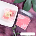 Pink self-adhesive plastic packaging bag for handmade soap, shown with dimensions 7cm by 7cm.
