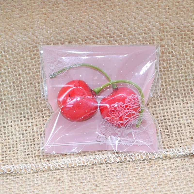 Pink self-adhesive plastic packaging bag for handmade soap, shown with dimensions 7cm by 7cm.