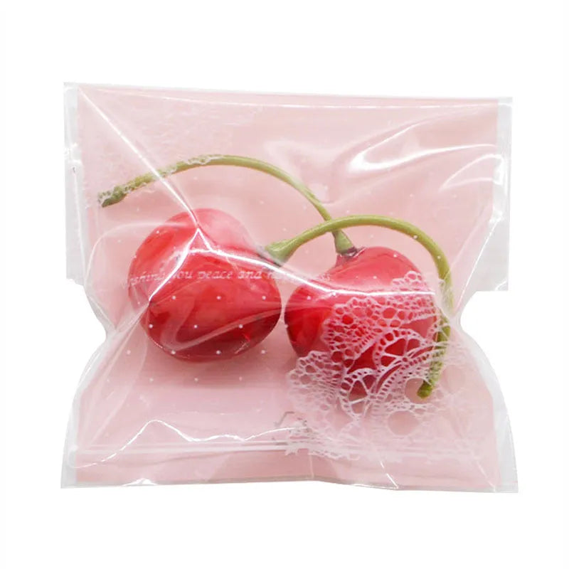 Pink self-adhesive plastic packaging bag for handmade soap, shown with dimensions 7cm by 7cm.