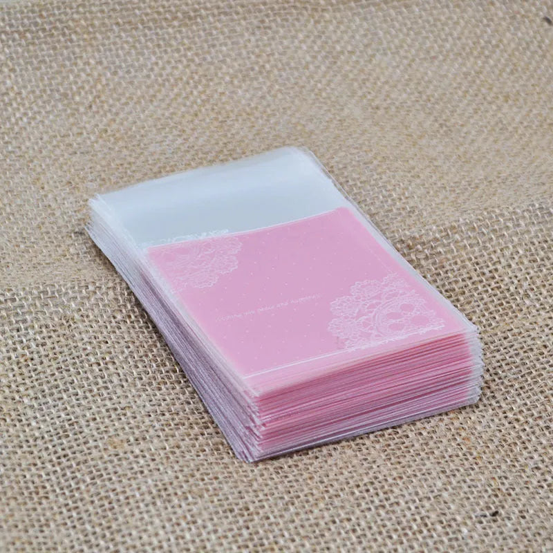 Pink self-adhesive plastic packaging bag for handmade soap, shown with dimensions 7cm by 7cm.