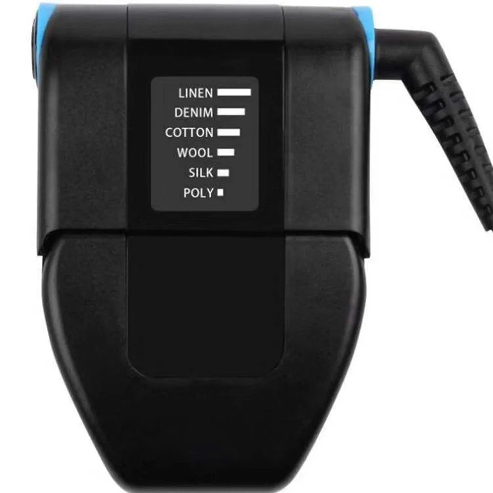 Small white portable handheld electric travel iron on a flat surface.