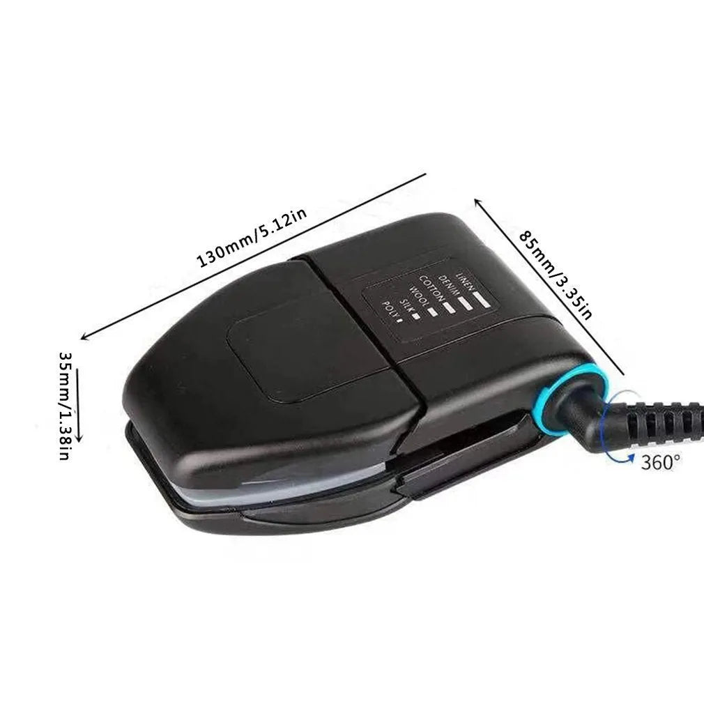 Small white portable handheld electric travel iron on a flat surface.