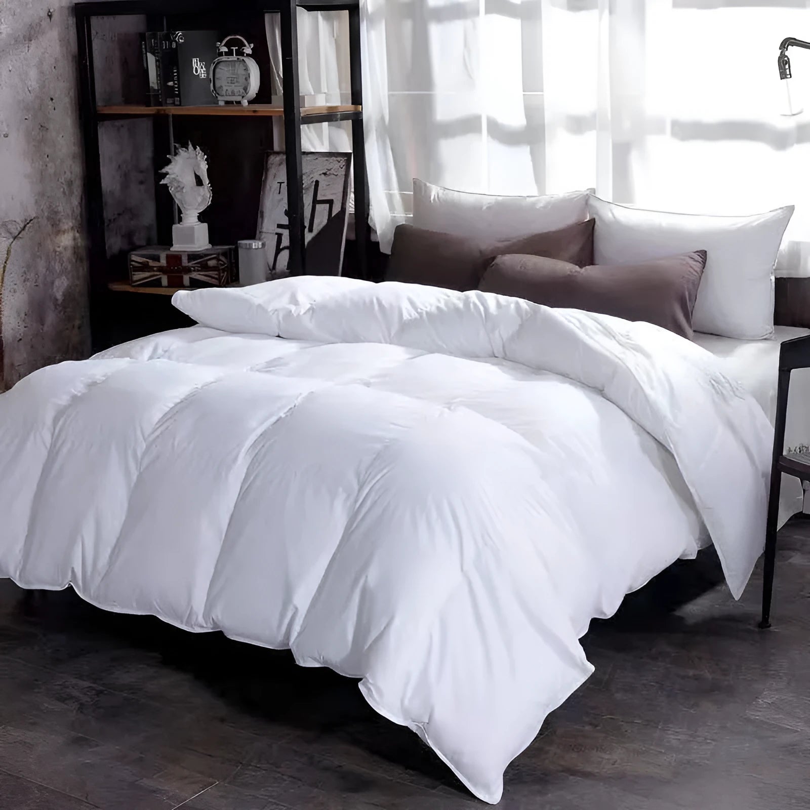 Goose down winter duvet in beige colour on a bed