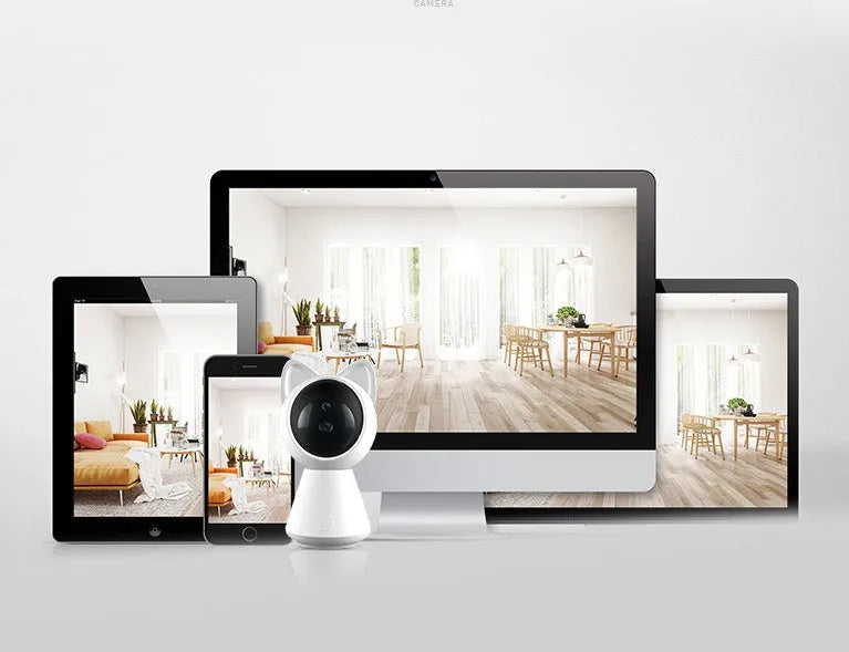 White wireless WiFi PTZ security camera on a table with a mobile phone showing its live feed.