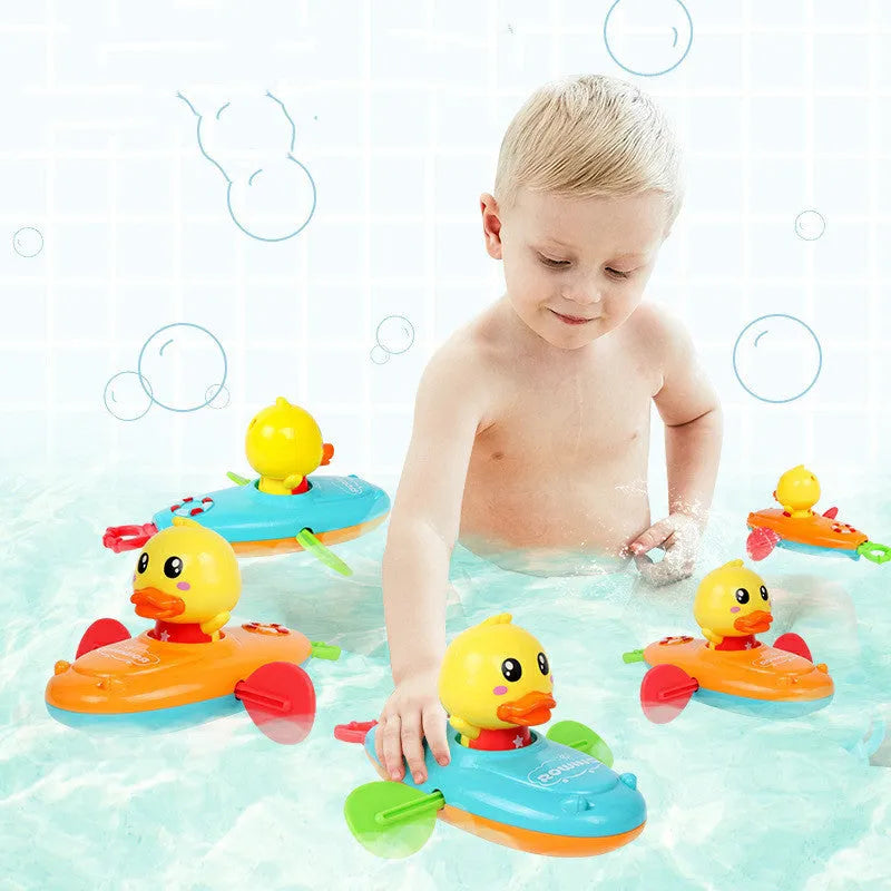 Yellow plastic wind-up swimming bath toys for children floating in water