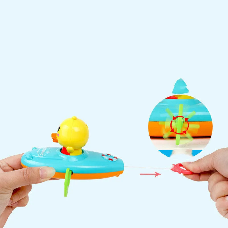 Yellow plastic wind-up swimming bath toys for children floating in water