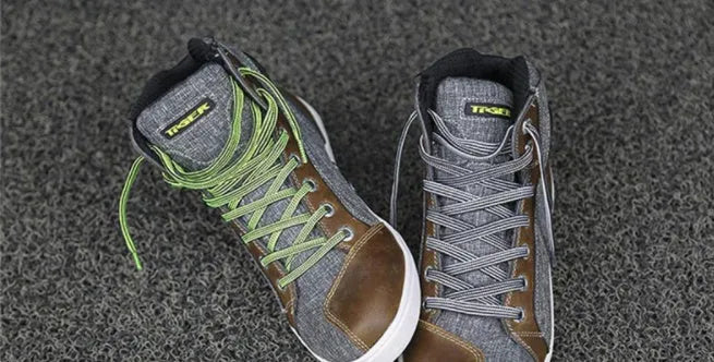 Black and grey men's casual motorcycle short boots showing breathable design and ankle protection.