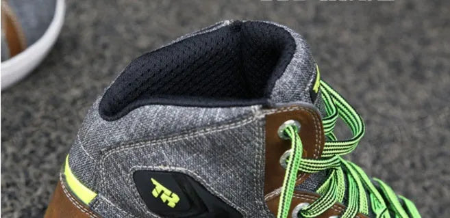 Black and grey men's casual motorcycle short boots showing breathable design and ankle protection.