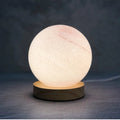 Nordic style table lamp with glass shade in various colours, powered by USB.