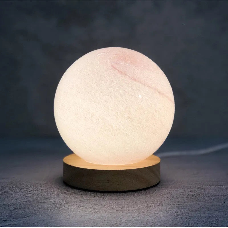 Nordic style table lamp with glass shade in various colours, powered by USB.