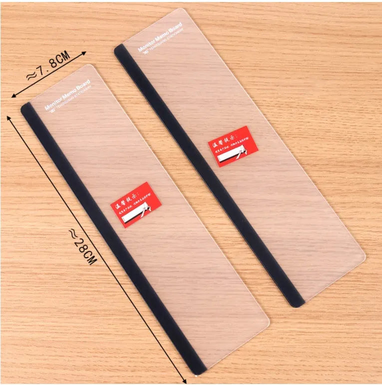 Clear acrylic computer monitor side pane note board measuring 28x7.8cm attached to a monitor