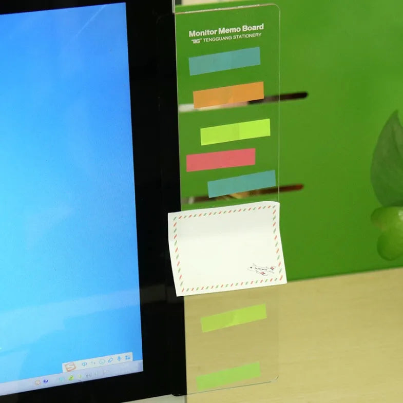 Clear acrylic computer monitor side pane note board measuring 28x7.8cm attached to a monitor