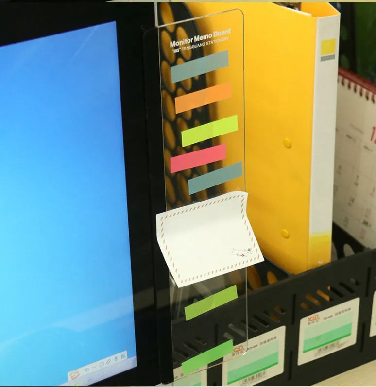 Clear acrylic computer monitor side pane note board measuring 28x7.8cm attached to a monitor