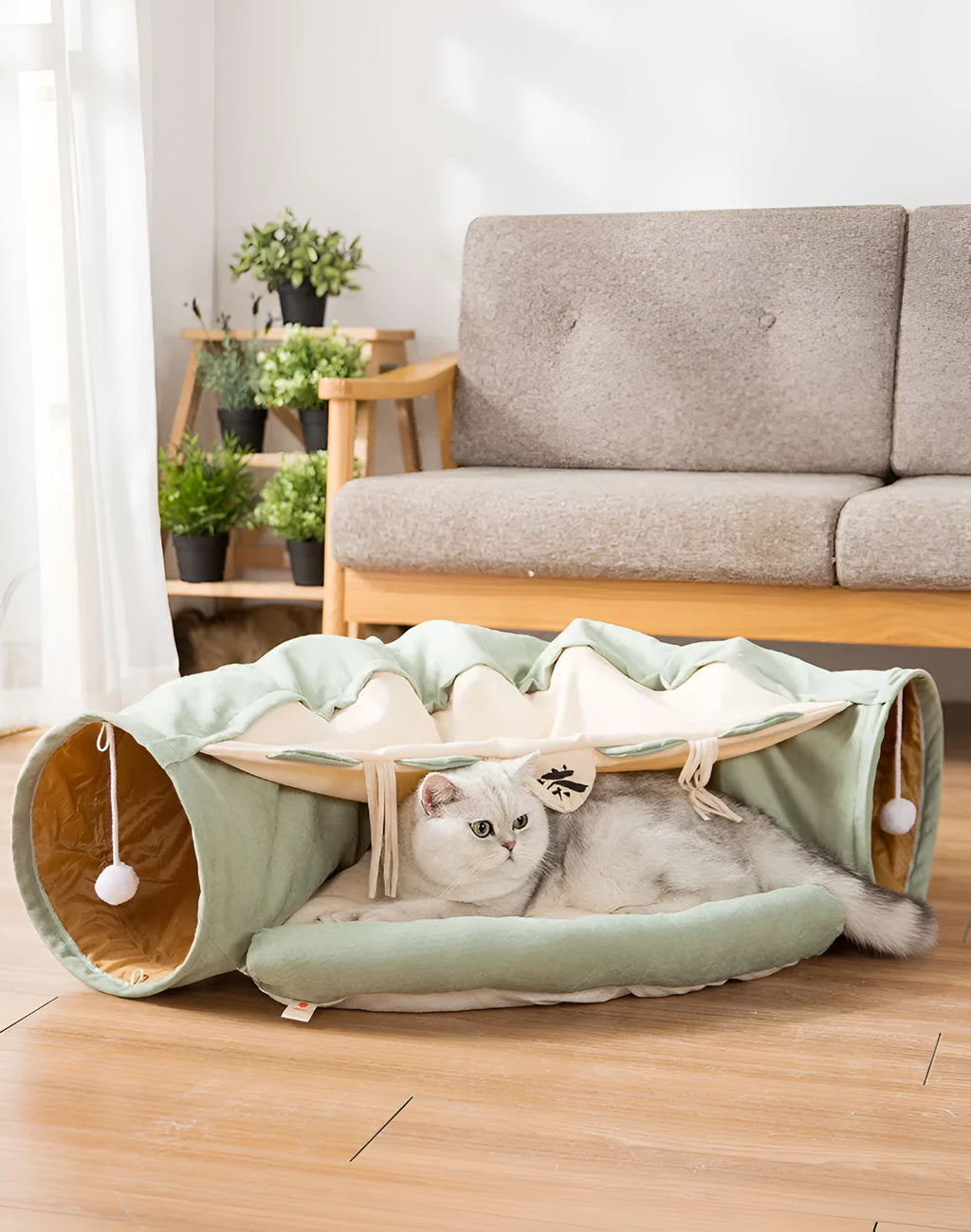 Collapsible cloth cat tunnel folded and unfolded, showing bar design pattern.
