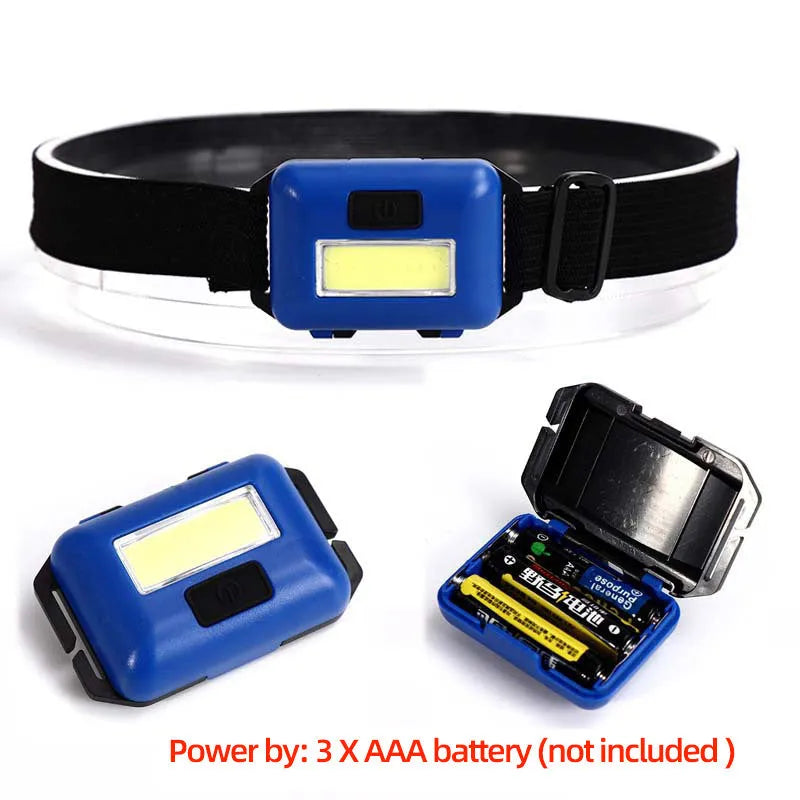 Compact black, blue, or red outdoor mini COB LED headlight with adjustable polyester strap.