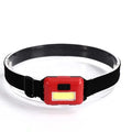 Compact black, blue, or red outdoor mini COB LED headlight with adjustable polyester strap.