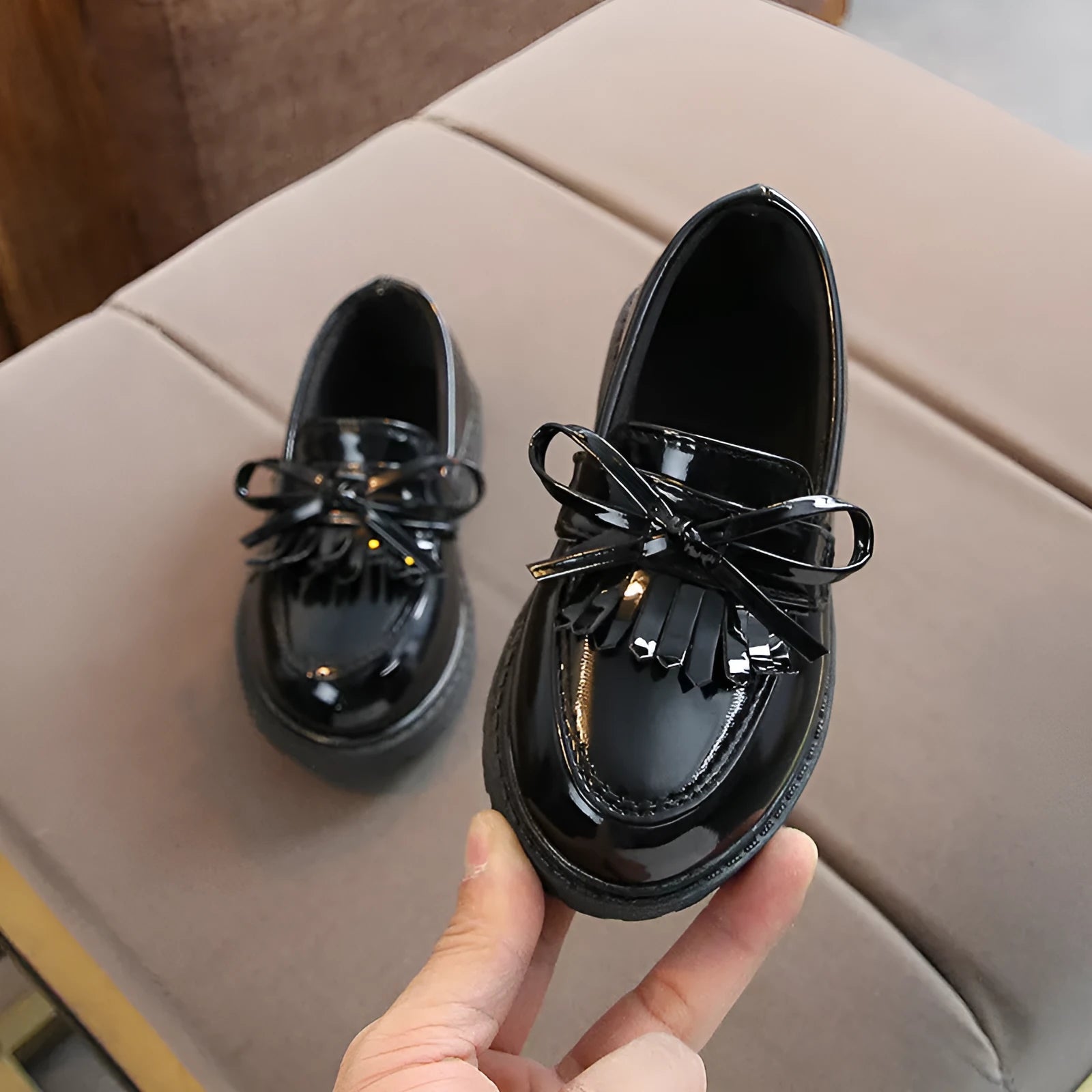Childrens vintage synthetic leather sneakers in brown with car suture detailing, low-top design