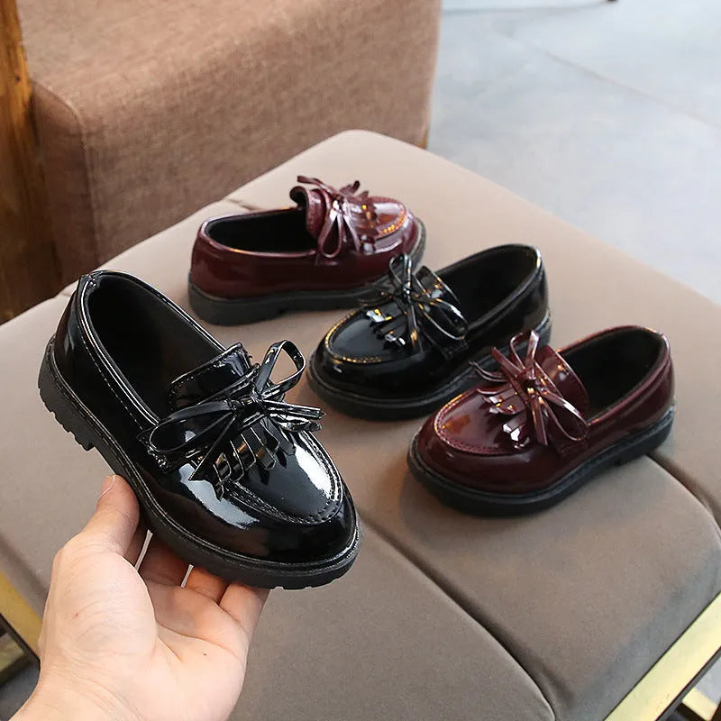 Childrens vintage synthetic leather sneakers in brown with car suture detailing, low-top design