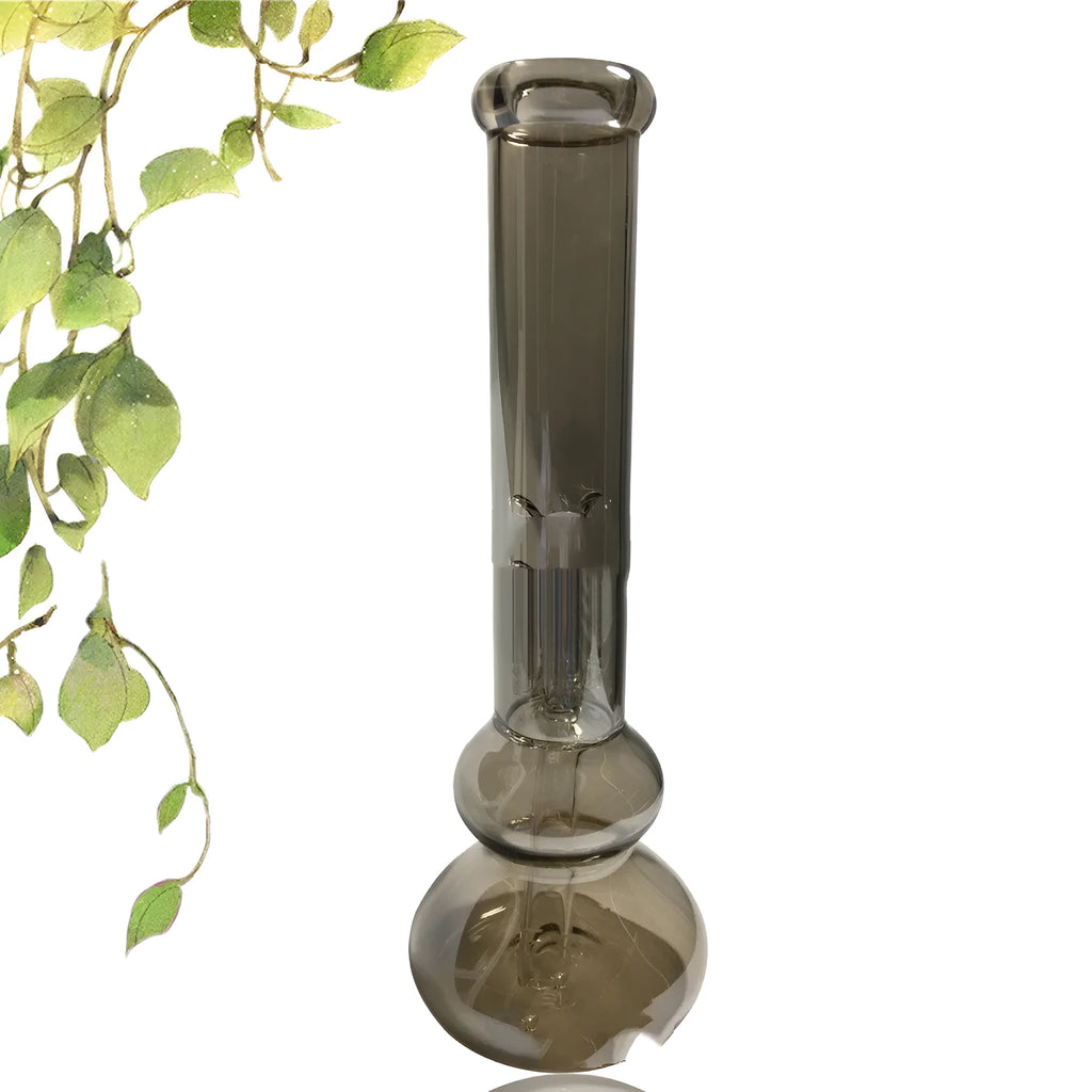 Pure colour glass geometric ornaments sitting on the rim of a clear vase.