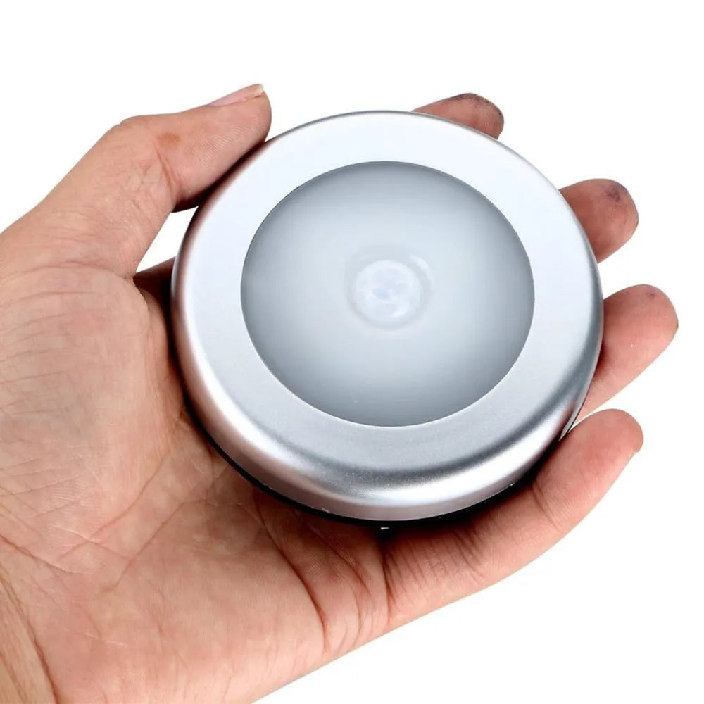 Silver square wireless motion sensor night light on a surface, dimensions 80mm by 80mm.