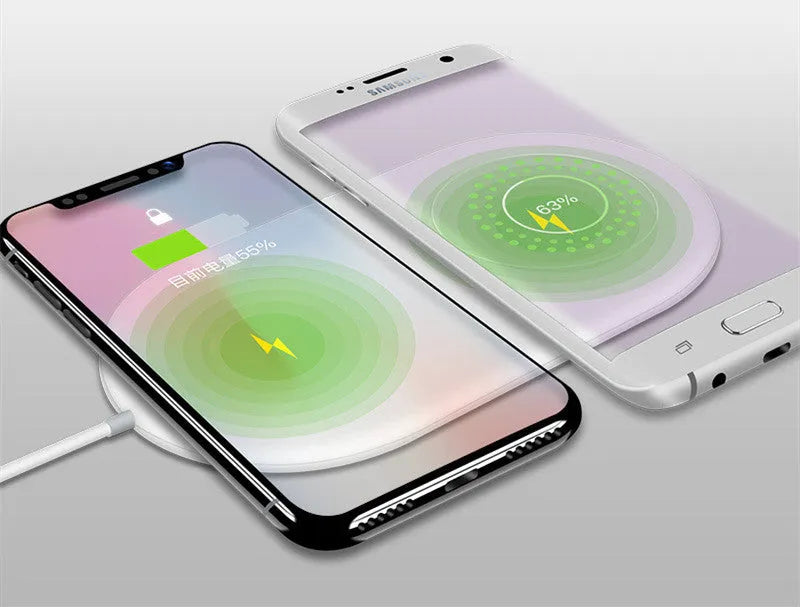 Simple white dual wireless fast charger for two mobile phones on a table