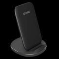 Vertical wireless charging dock in white holding smartphone at angle