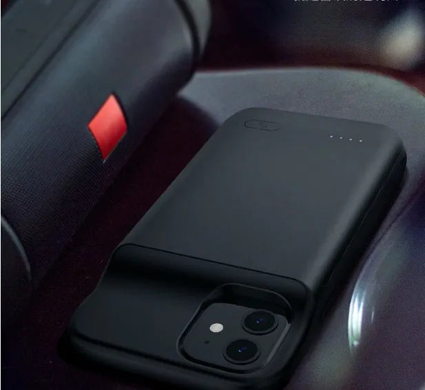 Black wireless back clip battery for iPhone 12 with ultra-thin TPU case showing multi-USB ports