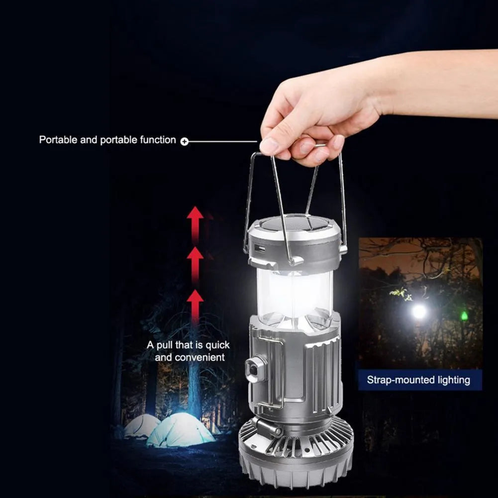 Solar electric fan lantern with waterproof casing and LED light in silver colour for camping use