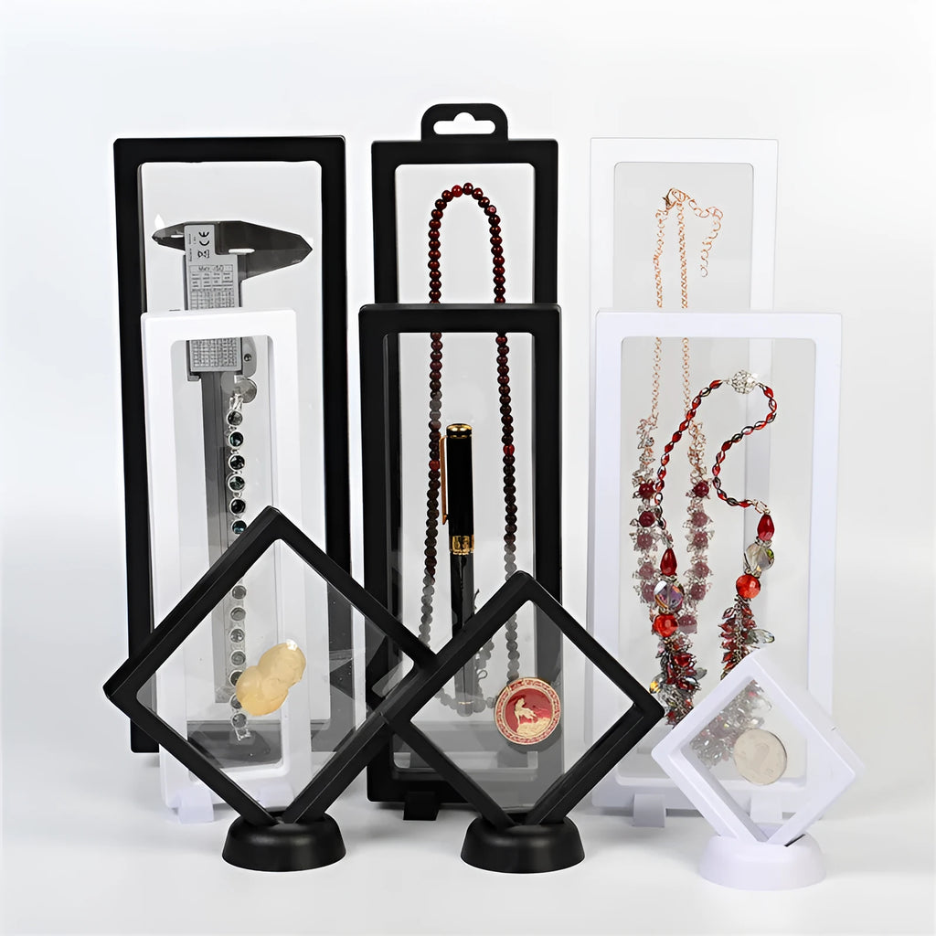 3D floating display box with ABS frame and clear TPU films, shown in black or white, for coins, medals, stamps, and jewellery.