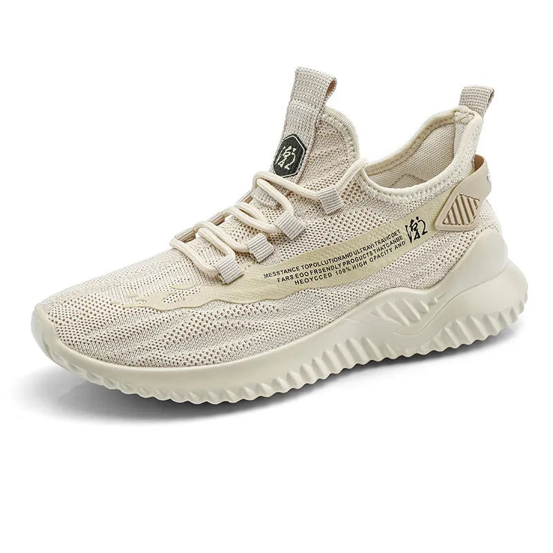 Men's white mesh sports shoe with rubber sole and round toe on a plain background.