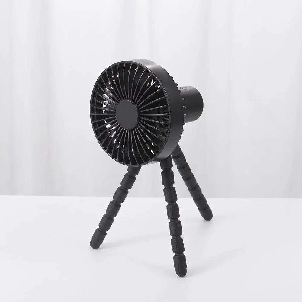 Black portable desktop fan with adjustable bending head and flexible octopus tripod legs.