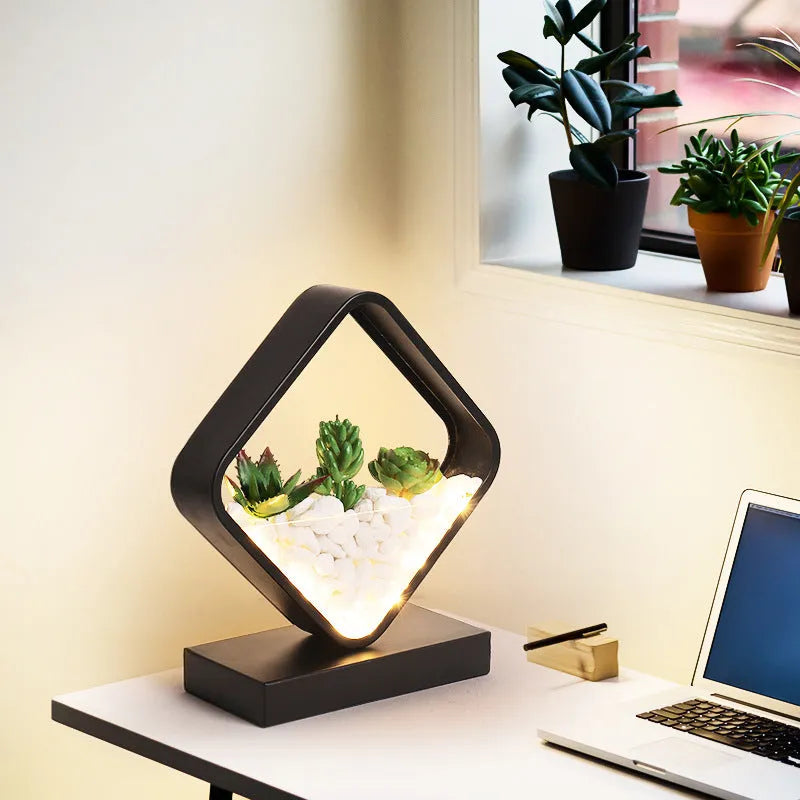 Black table lamp with metal lamp holder and push button switch on bedside table