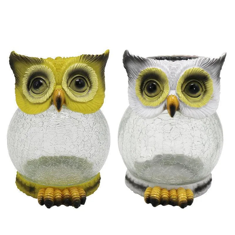 White solar-powered LED owl light for outdoor garden decoration with realistic details