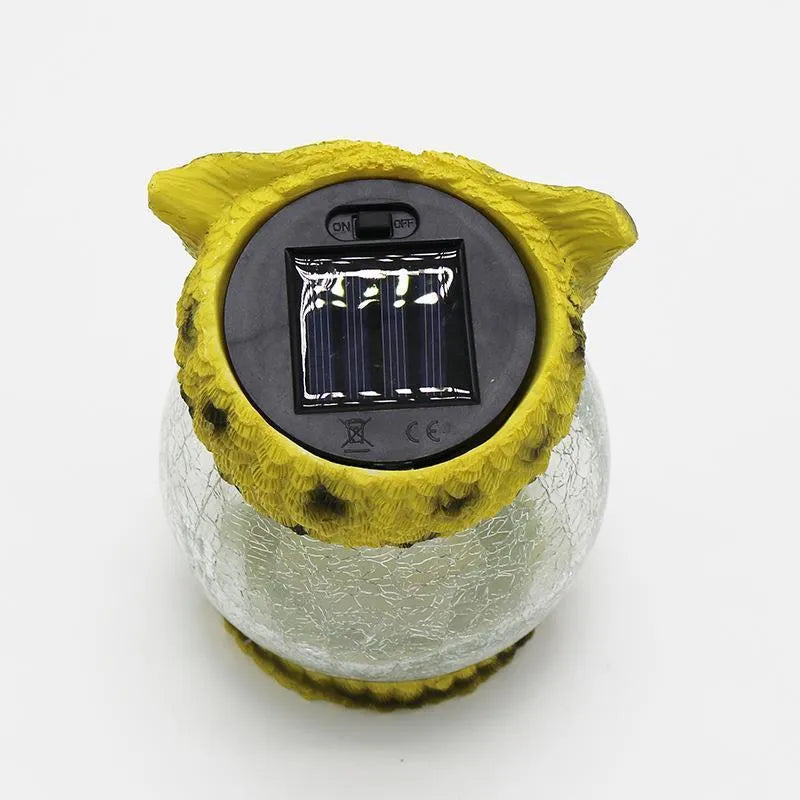 White solar-powered LED owl light for outdoor garden decoration with realistic details