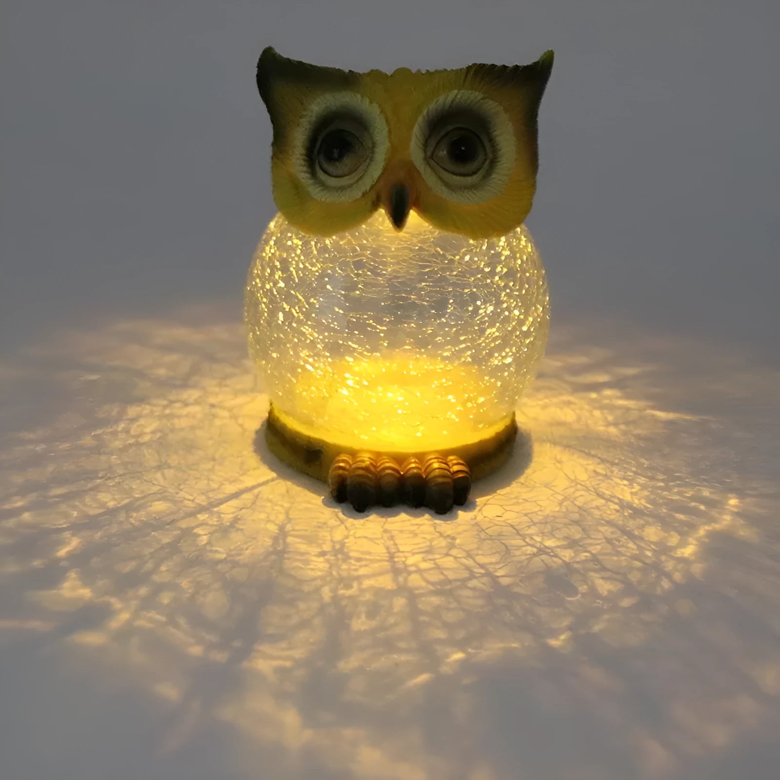 White solar-powered LED owl light for outdoor garden decoration with realistic details