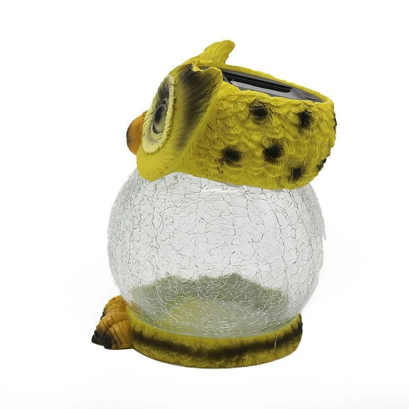 White solar-powered LED owl light for outdoor garden decoration with realistic details