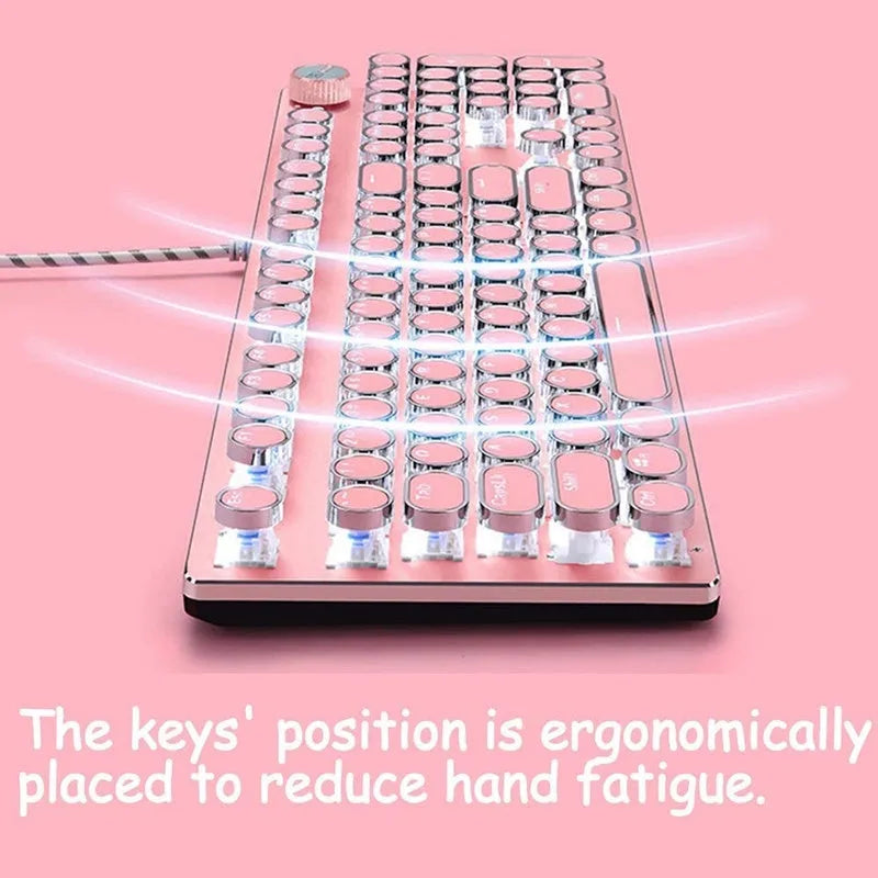 Pink and silver mechanical keyboard with green switches and matching wireless mouse on a desk.