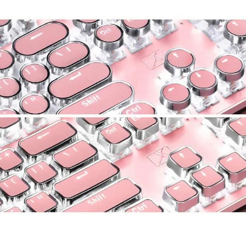 Pink and silver mechanical keyboard with green switches and matching wireless mouse on a desk.