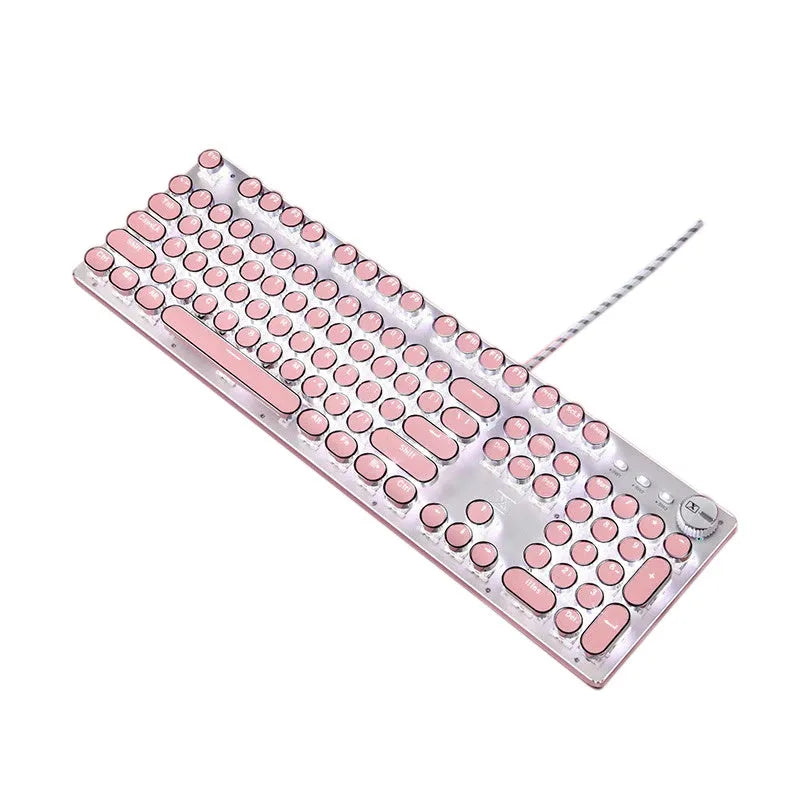Pink and silver mechanical keyboard with green switches and matching wireless mouse on a desk.