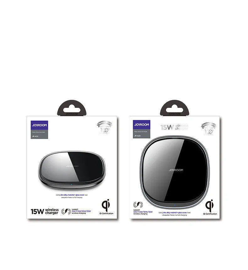 Black 15W Qi wireless fast charger with zinc alloy frame and glass top on a desk.