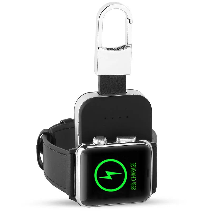 Black Apple Watch wireless charging power bank on a keychain, showing compact size.