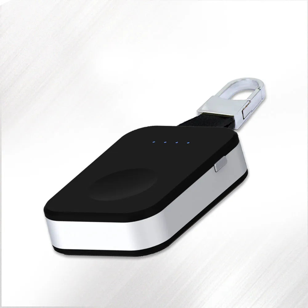 Black Apple Watch wireless charging power bank on a keychain, showing compact size.