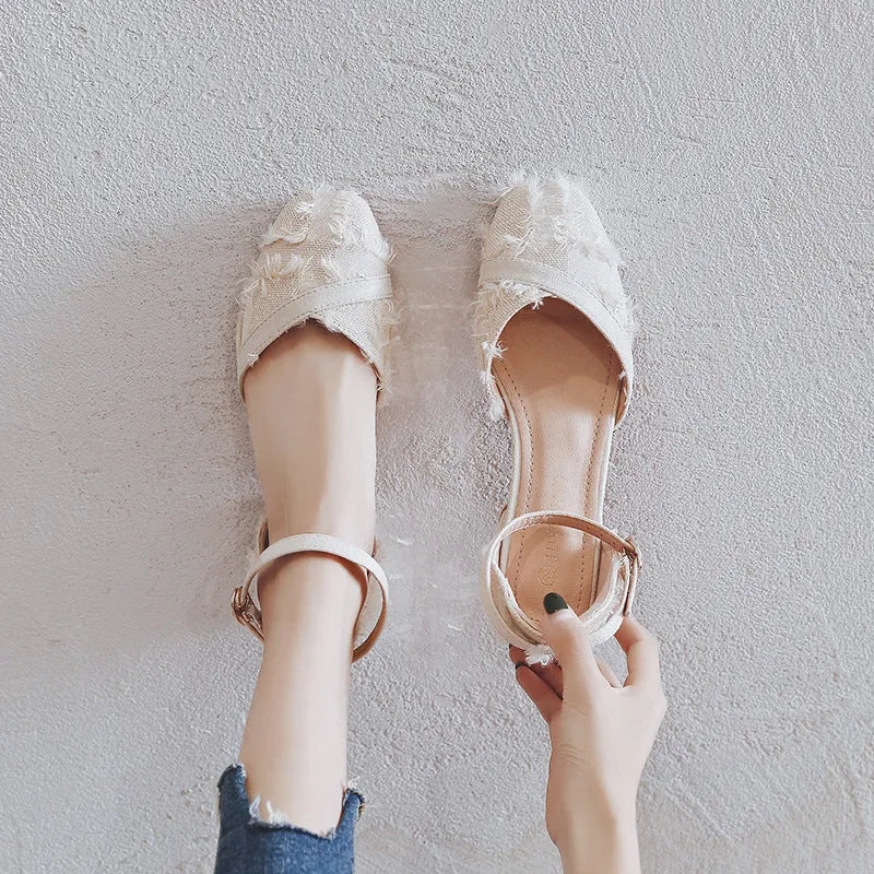 Women's apricot suede D'Orsay flats with an ankle strap and a low rubber sole.