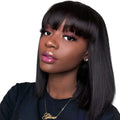 Unice machine-made human hair wig in black with 10-inch short to medium length style.