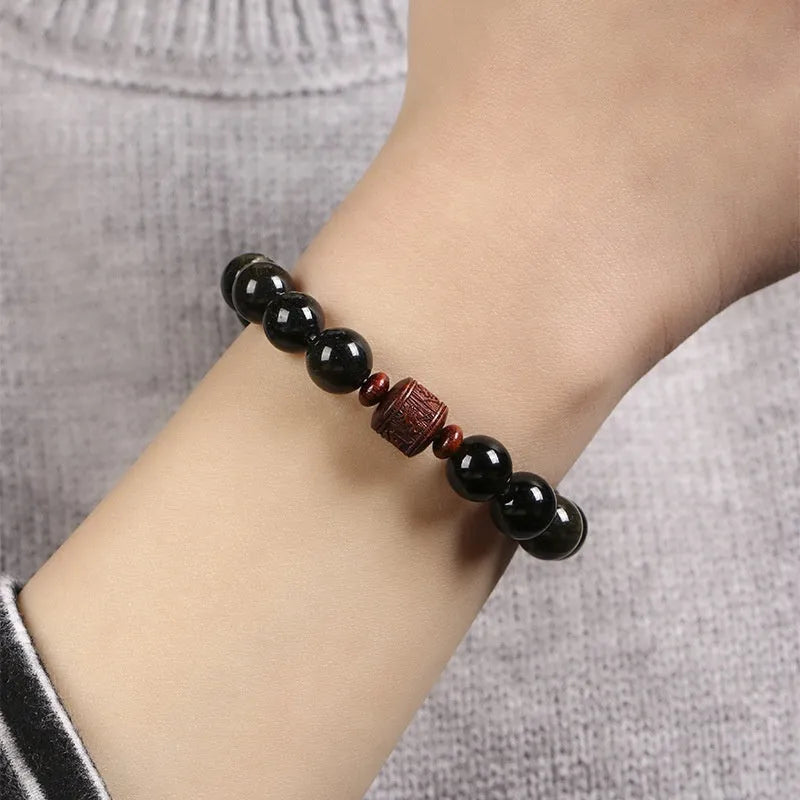 Hand-woven golden obsidian bracelet with 10mm round beads in a vintage style.