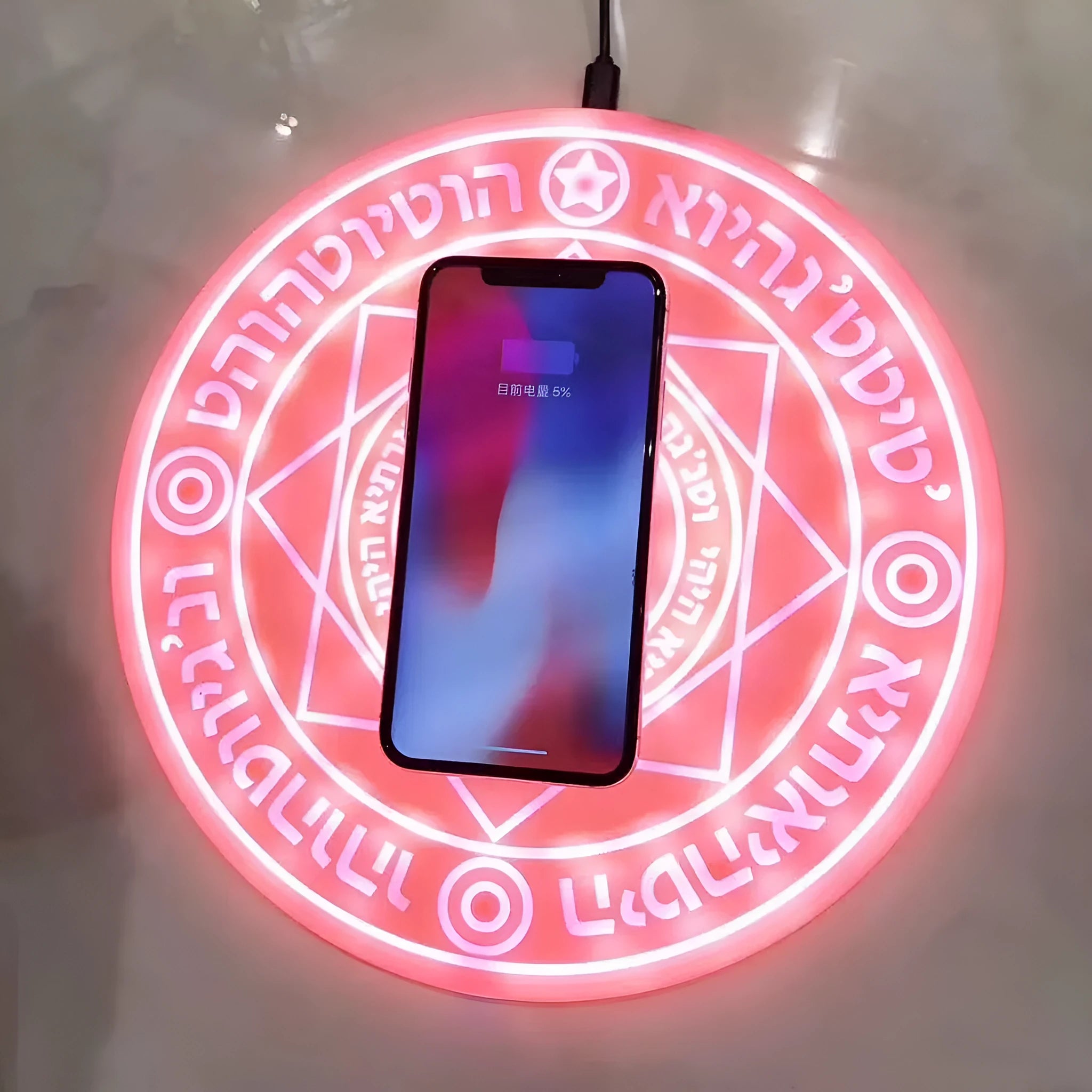 Square black 10W fast wireless charging pad with glowing magic array pattern for Qi phones